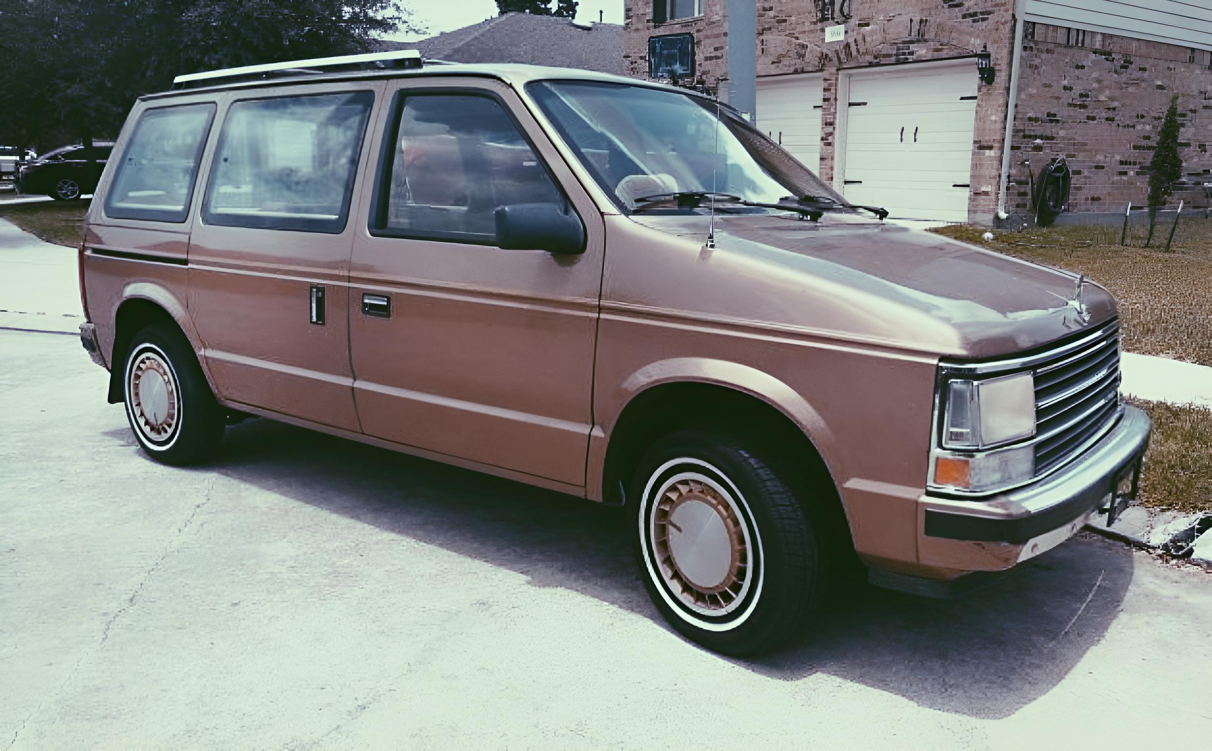 dodge caravan in front of house-AI enhanced