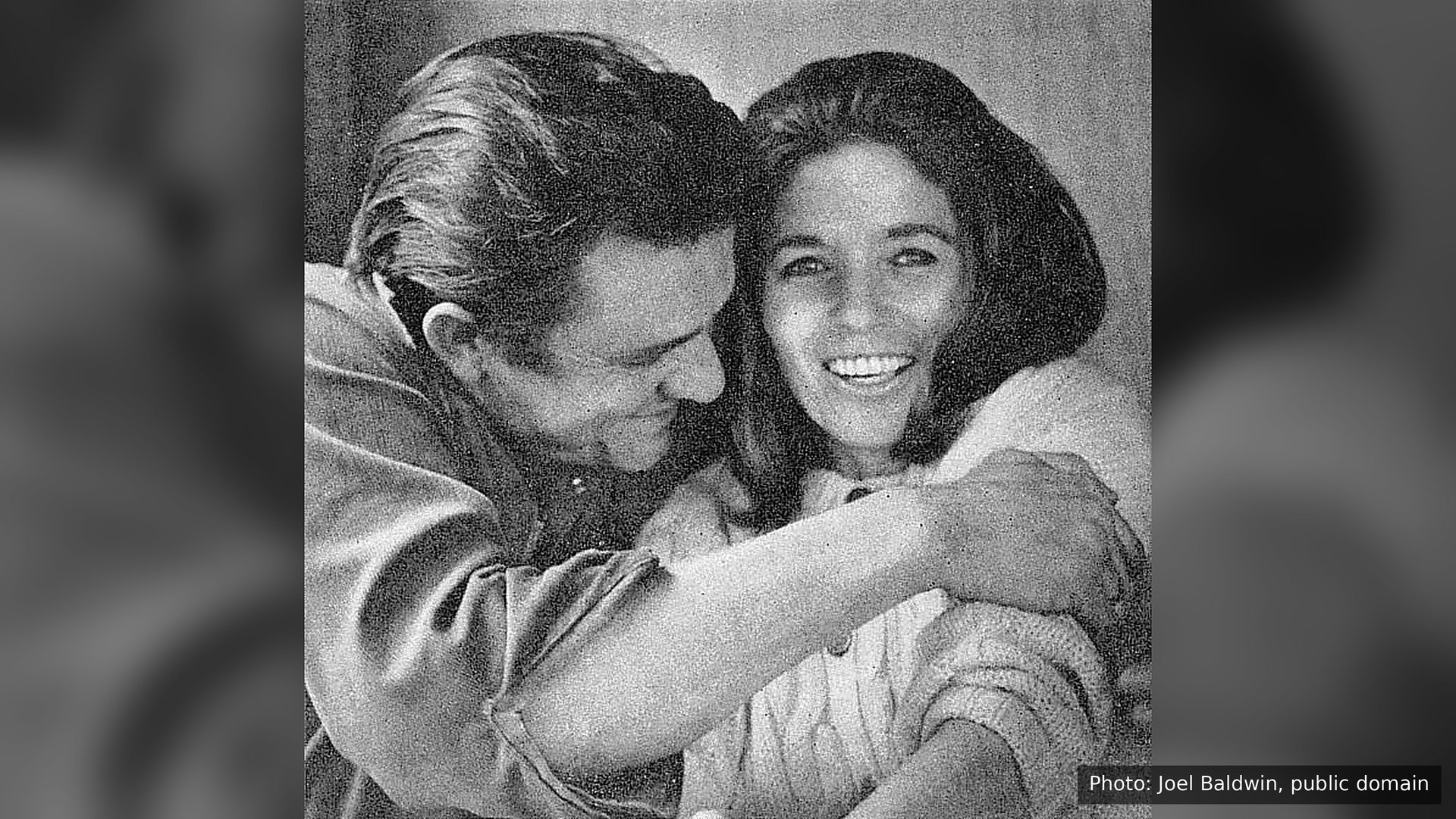 Johnny Cash hugging a laughing June Carter Cash, 1969